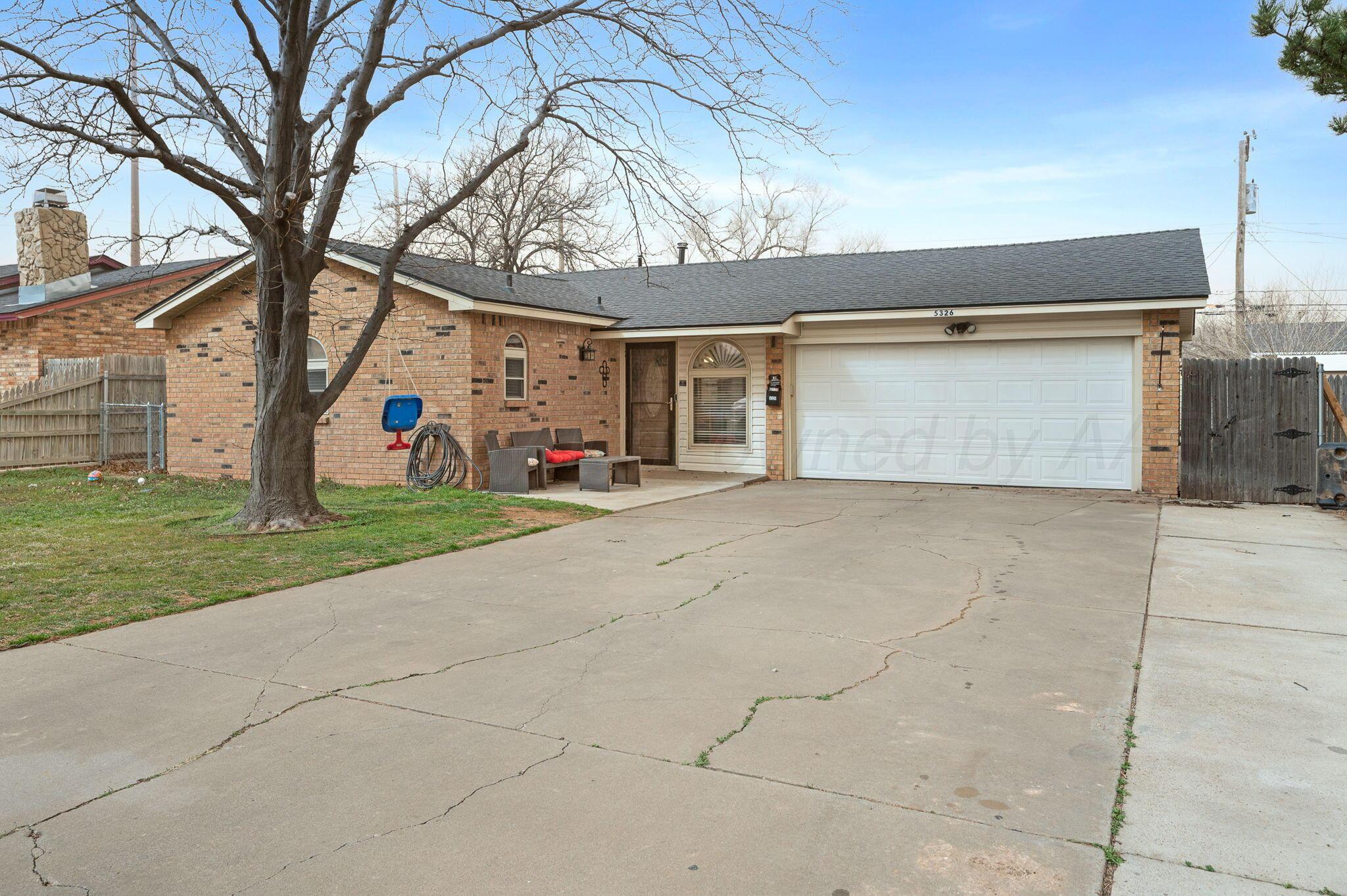 5326 Allen Street Amarillo, TX 79110 - Photo 1 of 17 a view of garage and yard