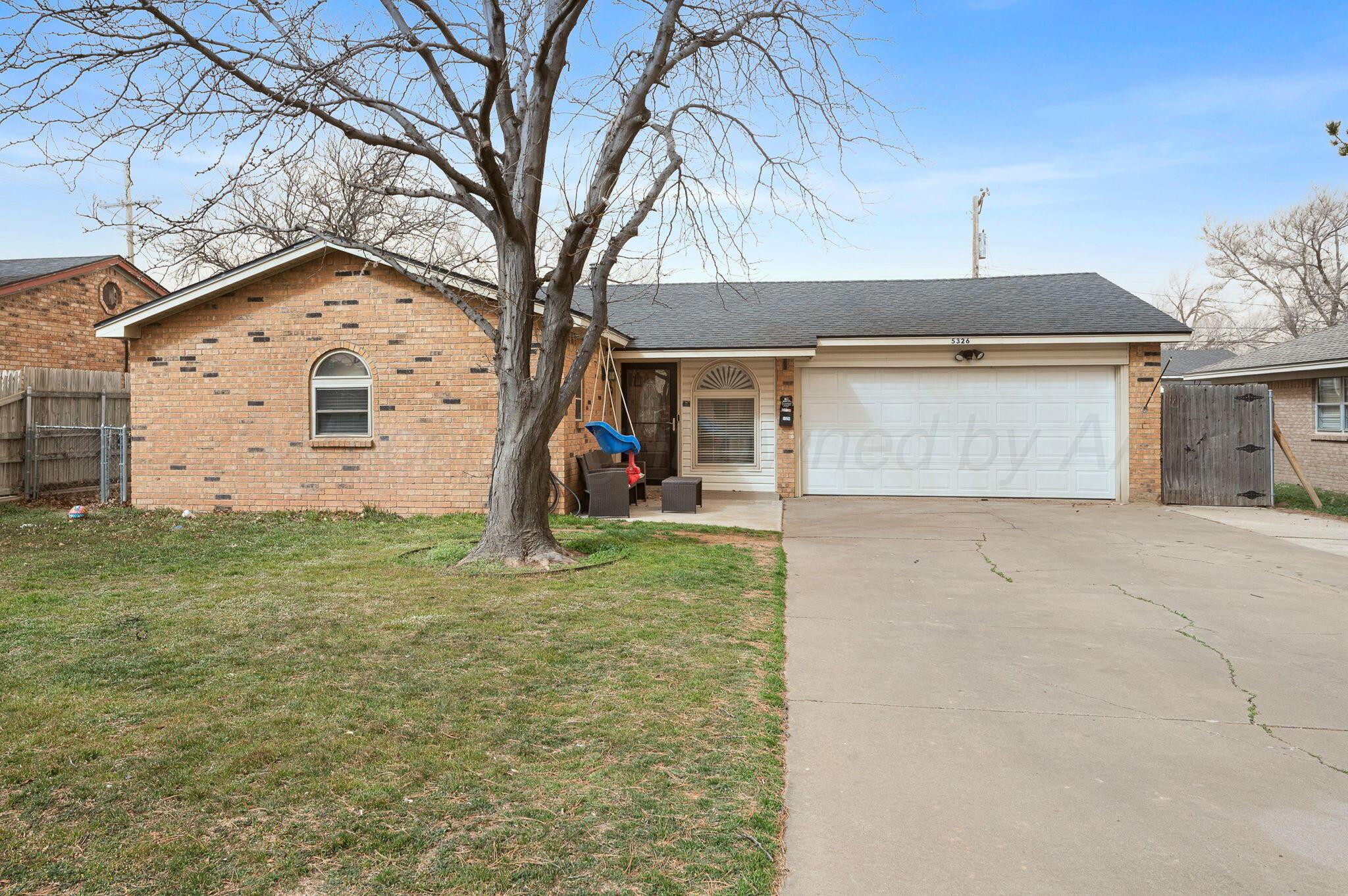 5326 Allen Street Amarillo, TX 79110 - Photo 17 of 17 a view of a house with a yard and garage