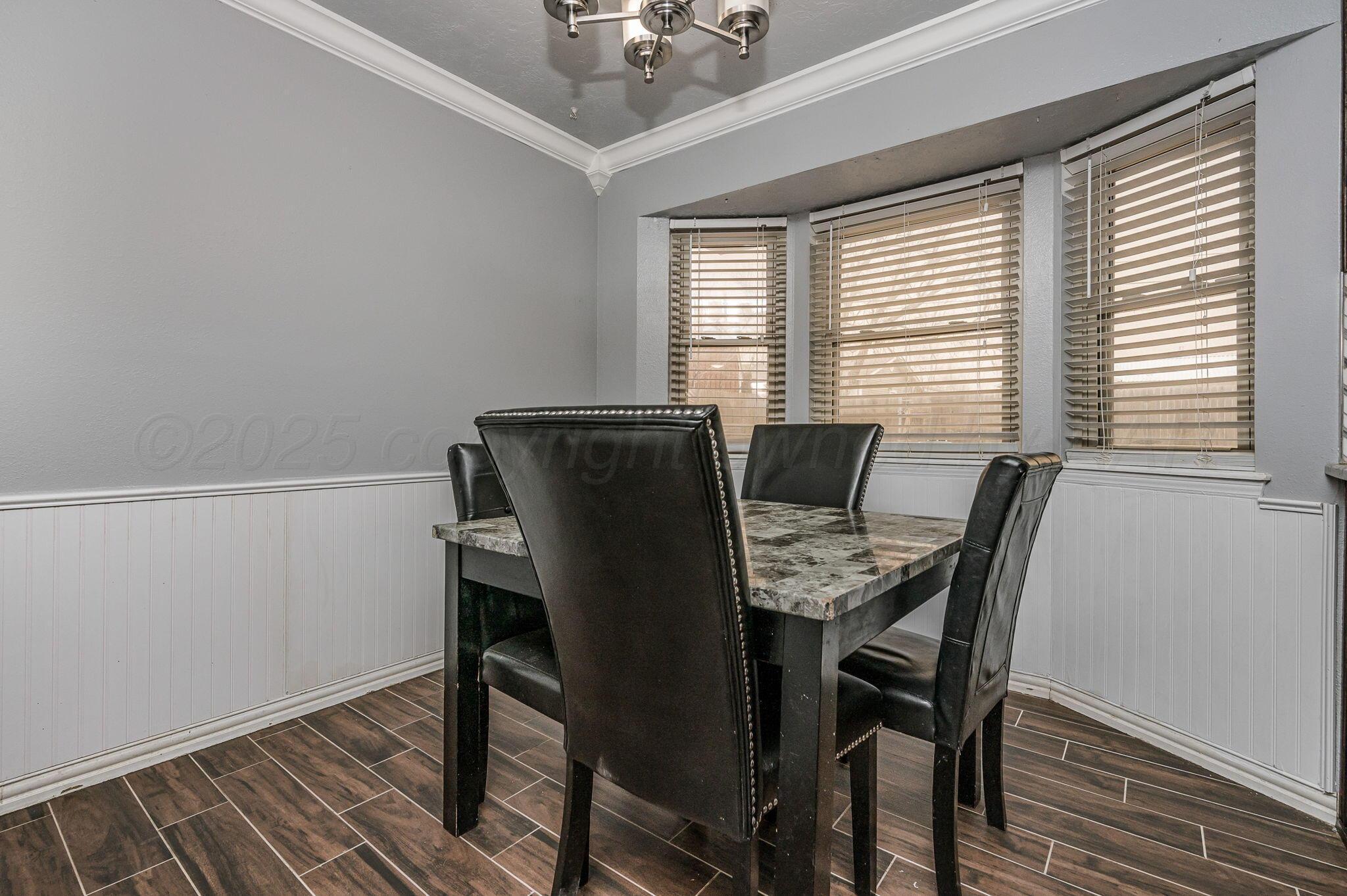 5326 Allen Street Amarillo, TX 79110 - Photo 4 of 17 a view of a dining room with furniture and a window