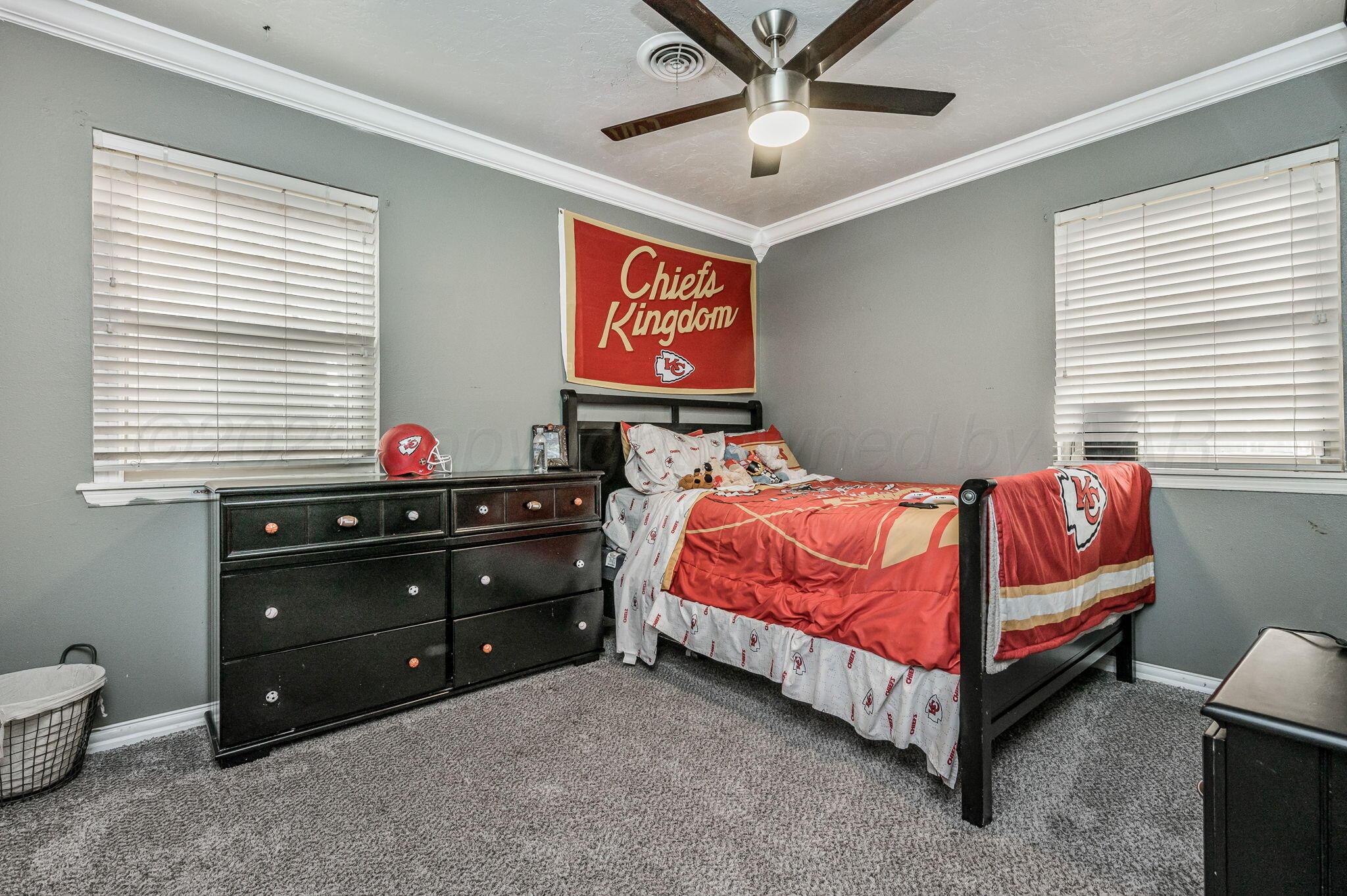 5326 Allen Street Amarillo, TX 79110 - Photo 10 of 17 a bed room with a bed and a window