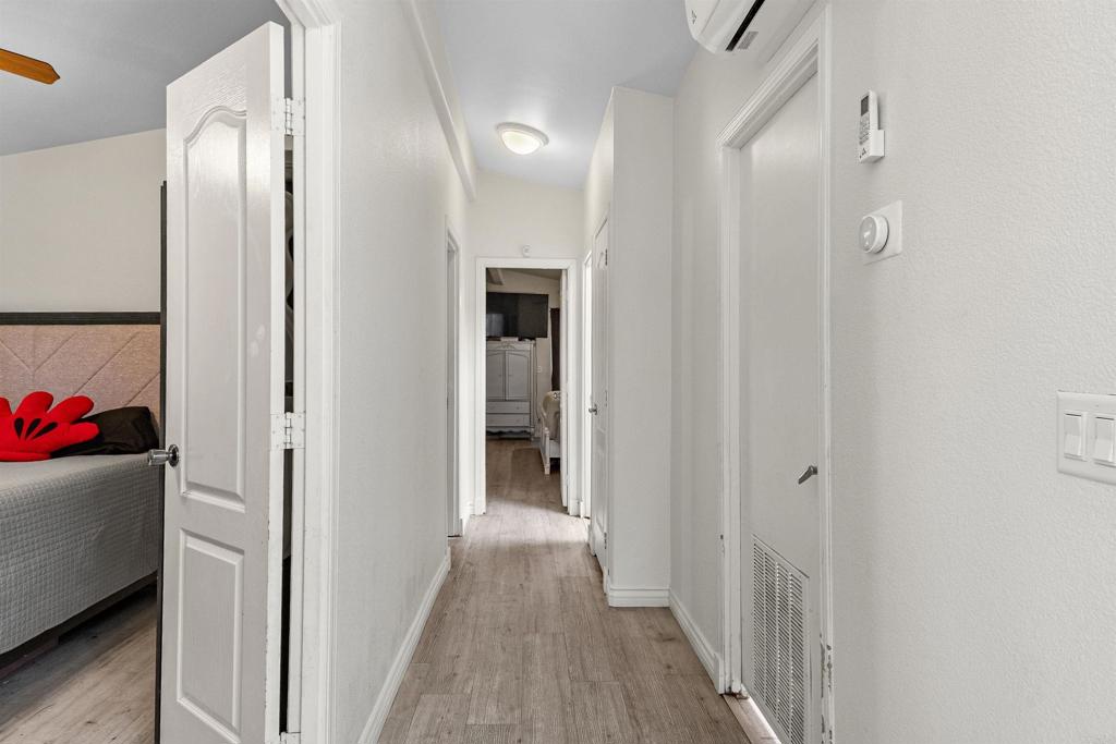 12044 Royal Road, Unit 121 El Cajon, CA 92021 - Photo 10 of 26 a view of a room with wooden floor and closet