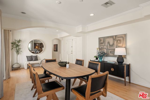 a view of a dining room with furniture and window