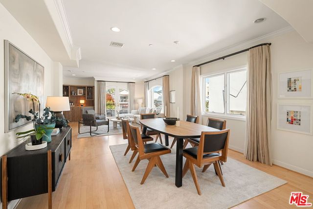 a view of a dining room with furniture and a window