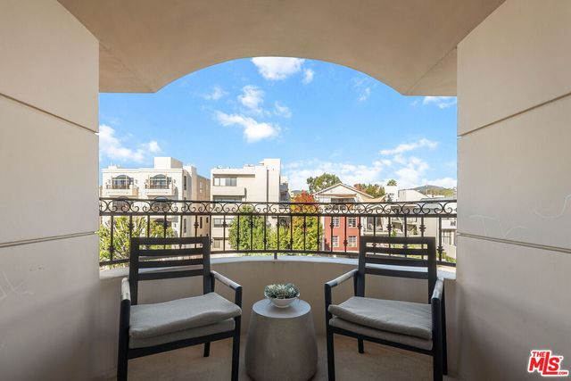 a living room with fireplace furniture and a flat screen tv