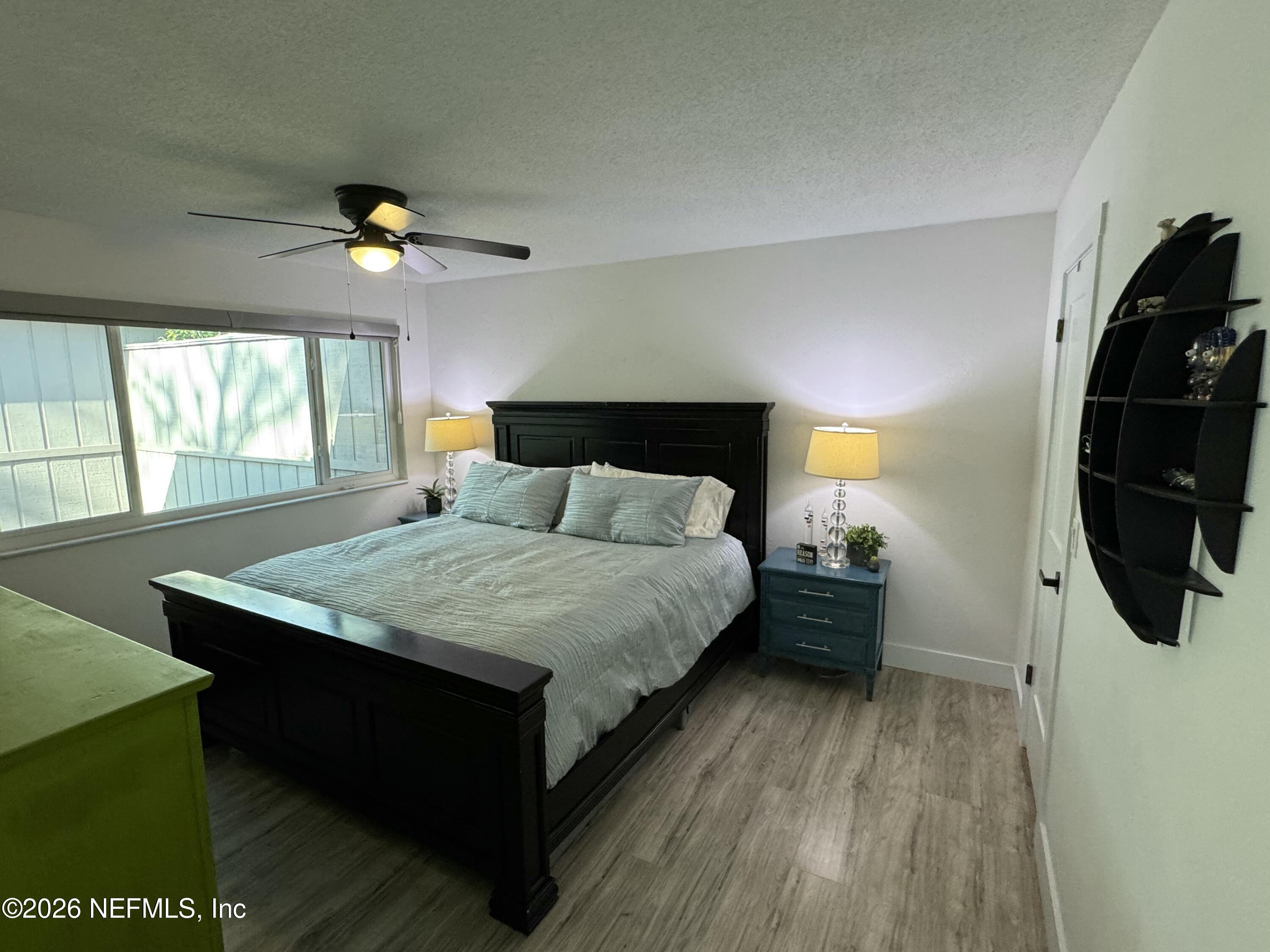 49 Cypress Pond Road Port Orange, FL 32128 - Photo 12 of 16 a bedroom with a bed and a mirror