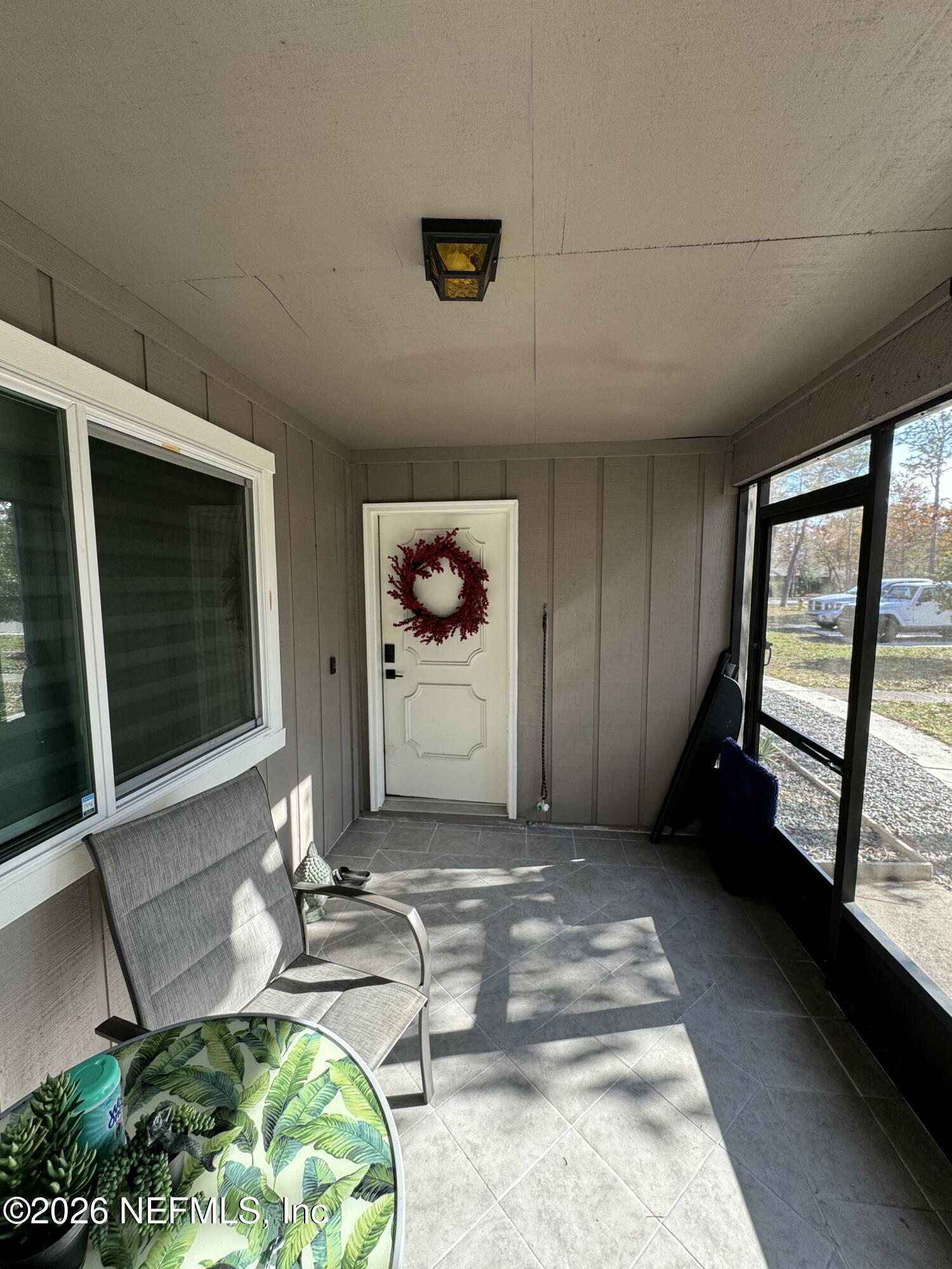 49 Cypress Pond Road Port Orange, FL 32128 - Photo 2 of 16 a room with furniture and a flat screen tv