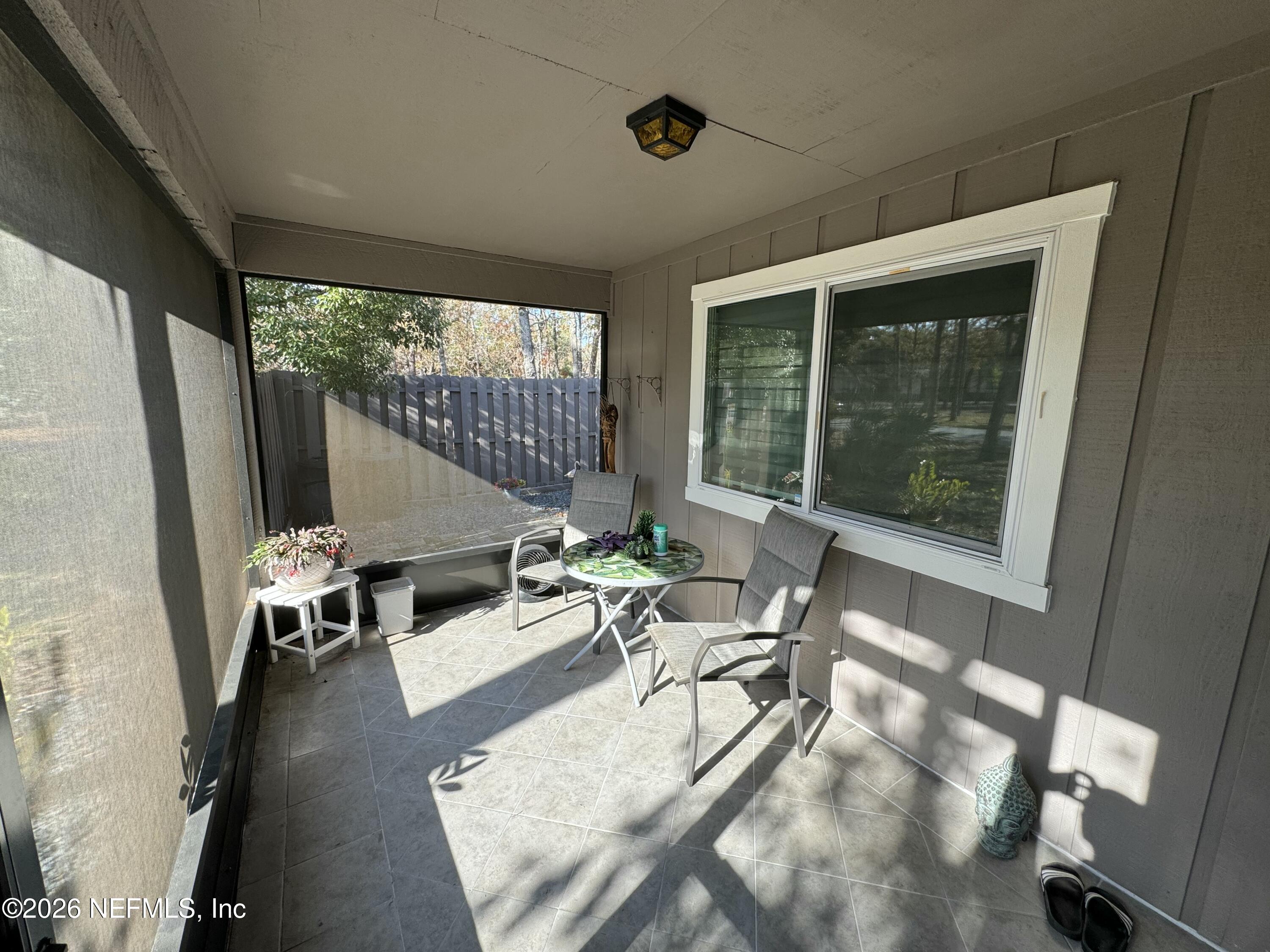 49 Cypress Pond Road Port Orange, FL 32128 - Photo 3 of 16 a living room with furniture and a large window