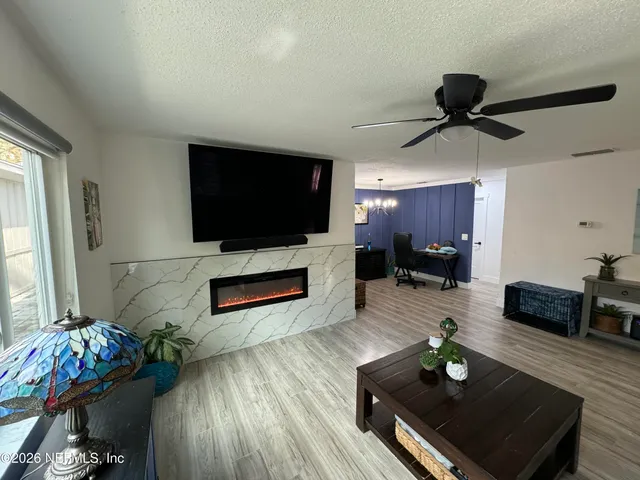 a living room with furniture and a flat screen tv
