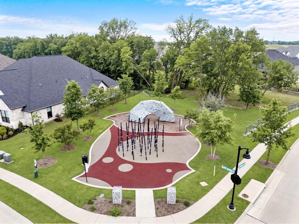 1632 Cotton Road Van Alstyne, TX 75495 - Photo 31 of 40 a view of a garden with a swimming pool