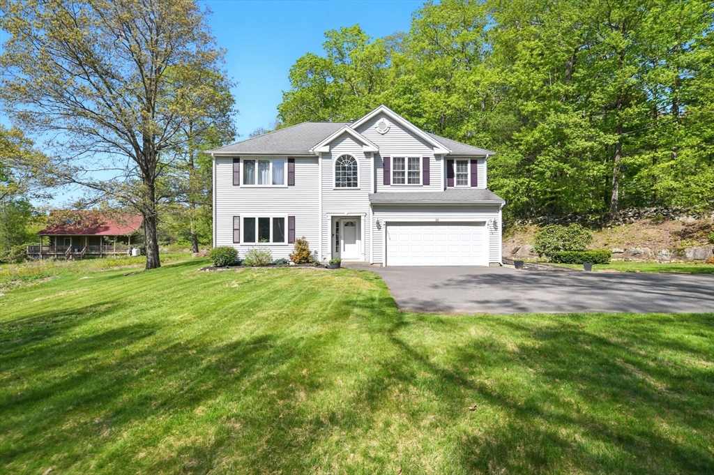 28 Ayers Road Monson, MA 01057 - Photo 1 of 42 a front view of a house with a yard and green space