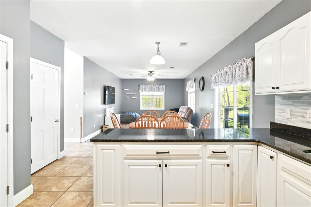 28 Ayers Road Monson, MA 01057 - Photo 19 of 42 a kitchen with a stove a sink and a window