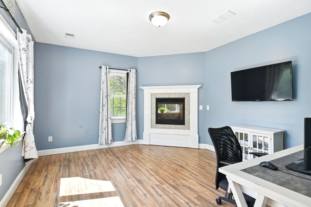 28 Ayers Road Monson, MA 01057 - Photo 20 of 42 a bedroom with a bed and a flat screen tv