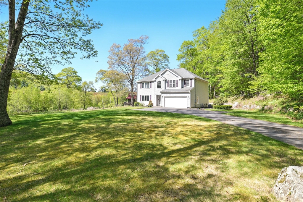 28 Ayers Road Monson, MA 01057 - Photo 2 of 42 a house with a big yard with large trees