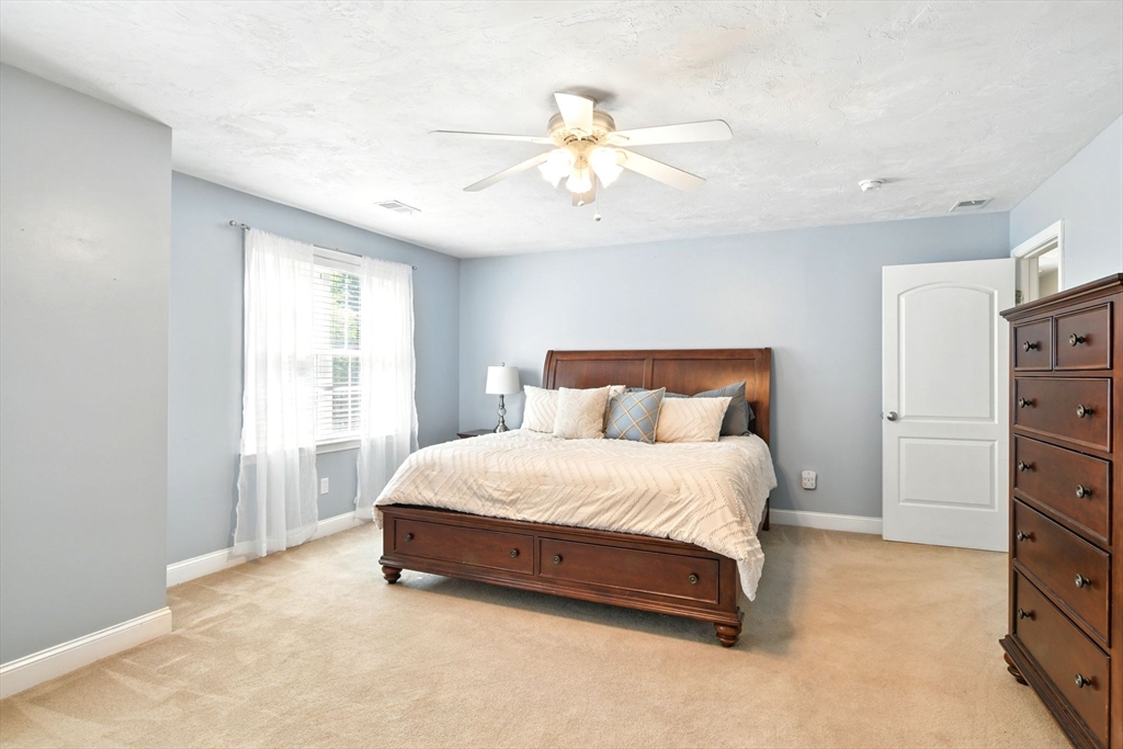28 Ayers Road Monson, MA 01057 - Photo 24 of 42 a spacious bedroom with a bed and a window