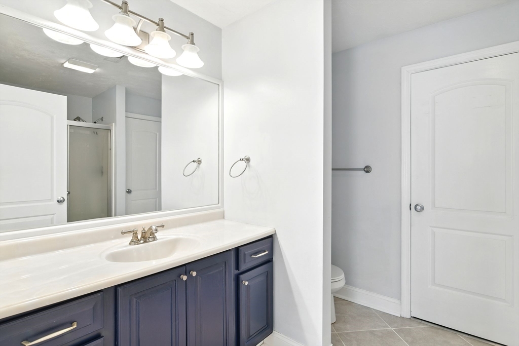 28 Ayers Road Monson, MA 01057 - Photo 27 of 42 a bathroom with a double vanity sink and a mirror