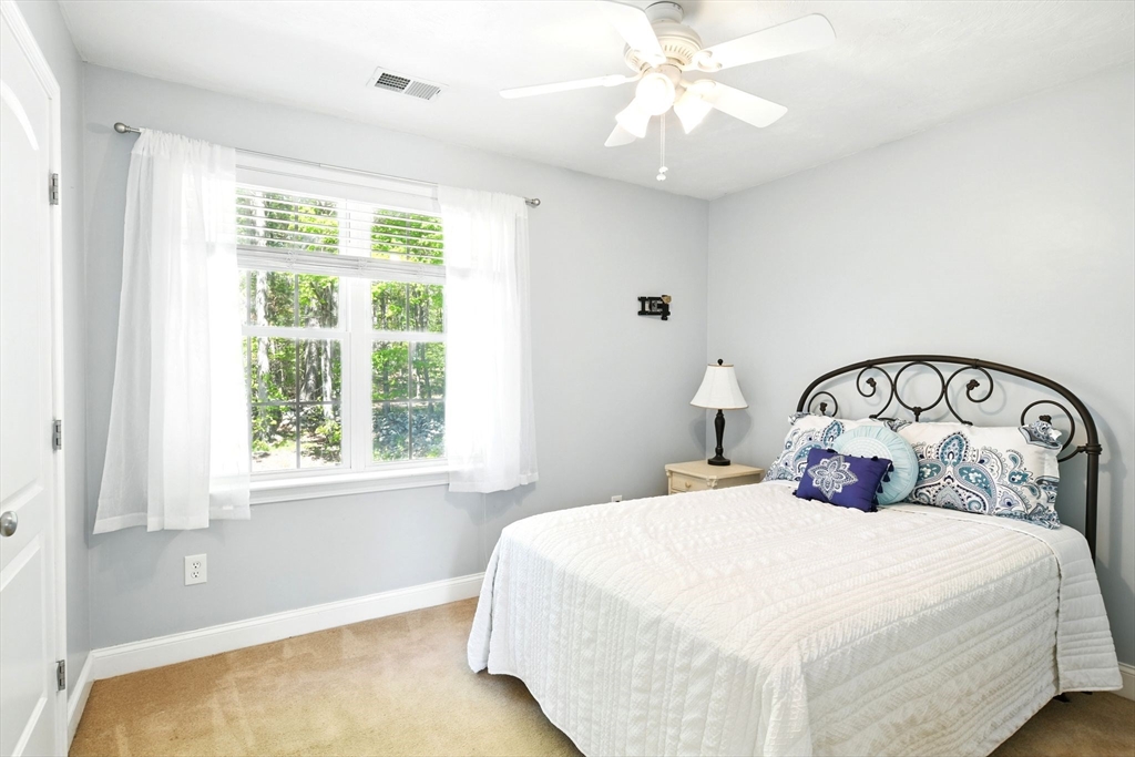 28 Ayers Road Monson, MA 01057 - Photo 29 of 42 a bedroom with a large bed and a window