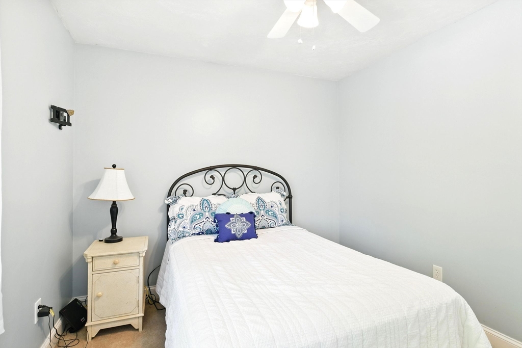 28 Ayers Road Monson, MA 01057 - Photo 30 of 42 a bedroom with a bed and a table in it