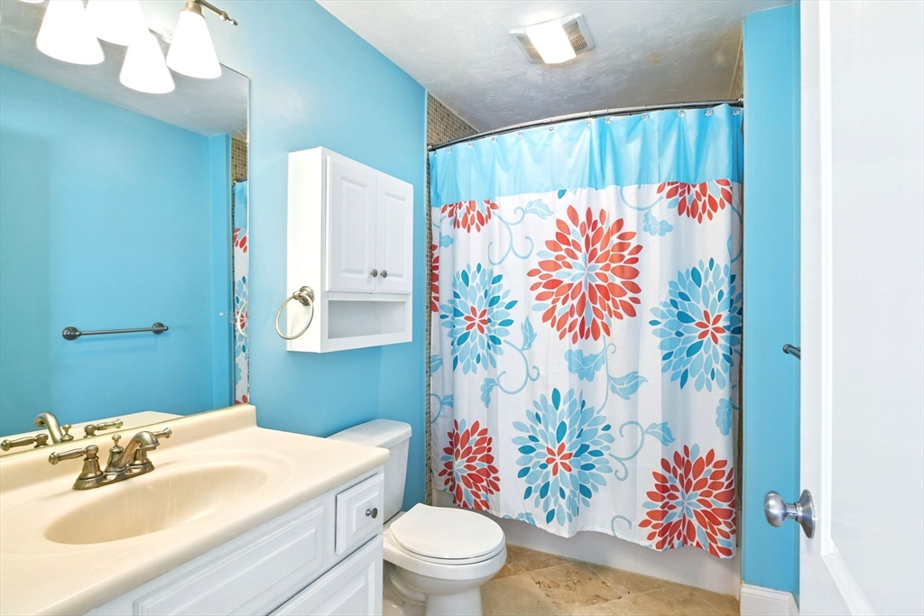 28 Ayers Road Monson, MA 01057 - Photo 33 of 42 a bathroom with a sink mirror vanity and toilet