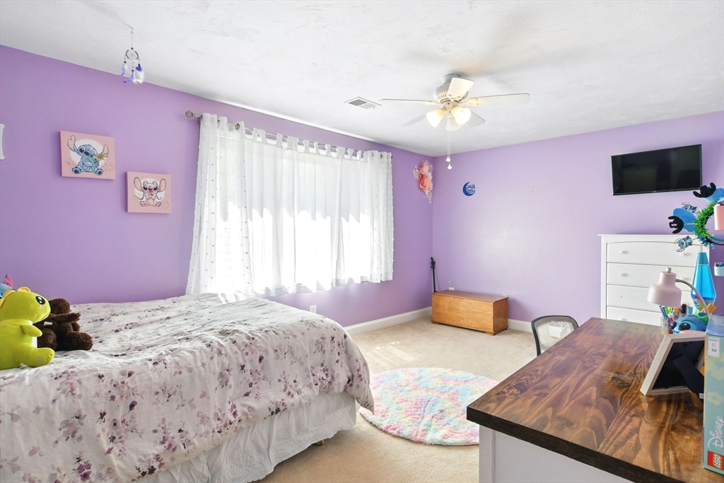 28 Ayers Road Monson, MA 01057 - Photo 37 of 42 a bedroom with a bed and a flat screen tv