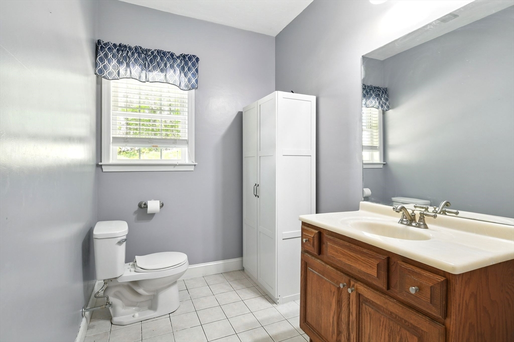 28 Ayers Road Monson, MA 01057 - Photo 40 of 42 a bathroom with a sink toilet and mirror