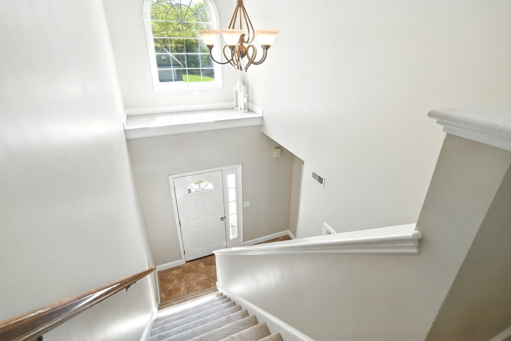 28 Ayers Road Monson, MA 01057 - Photo 7 of 42 a view of a room with wooden floor and windows