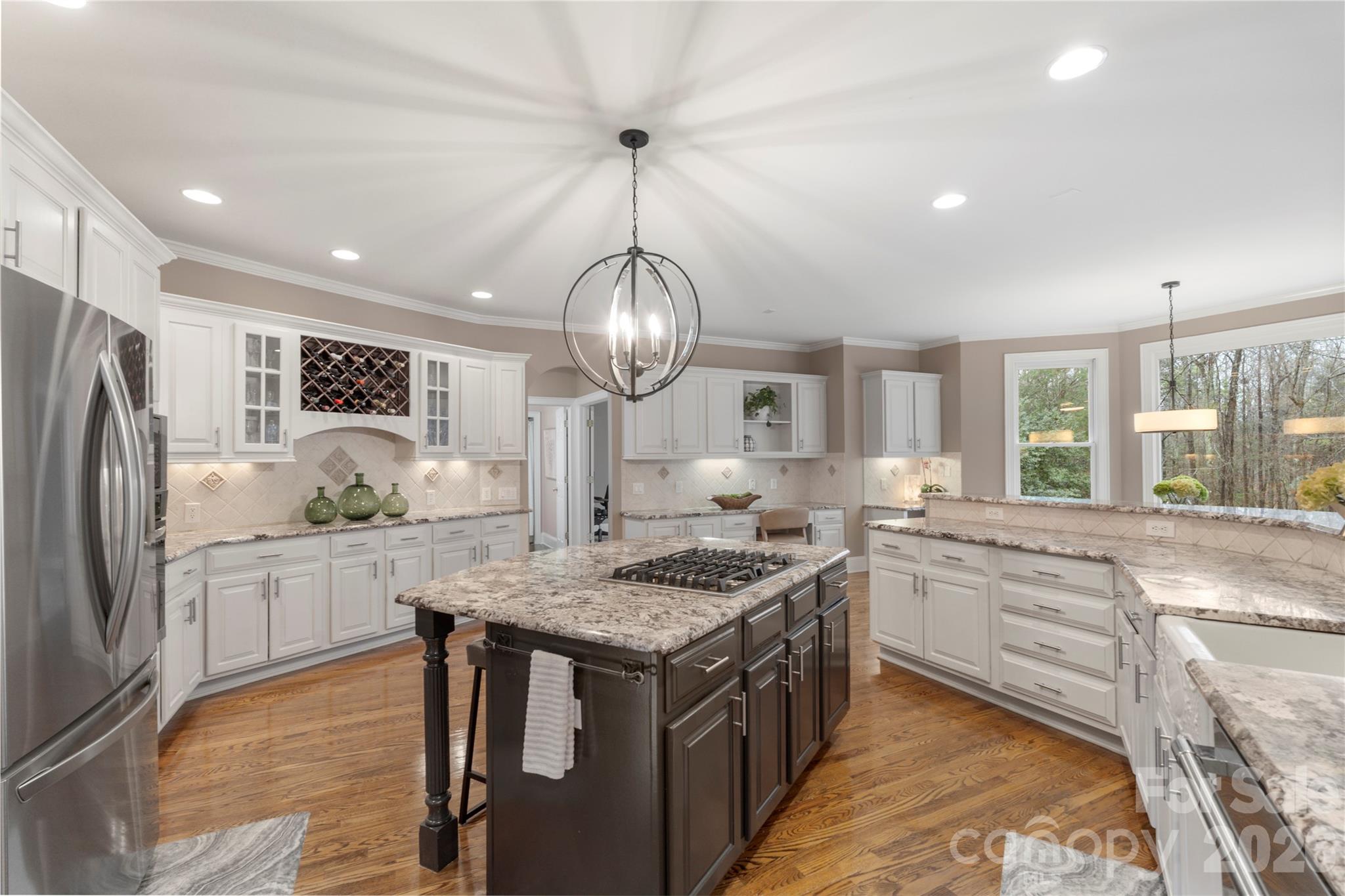 1716 Hickory Ridge Drive Waxhaw, NC 28173 - Photo 11 of 48 a kitchen with stainless steel appliances granite countertop a stove oven and a refrigerator