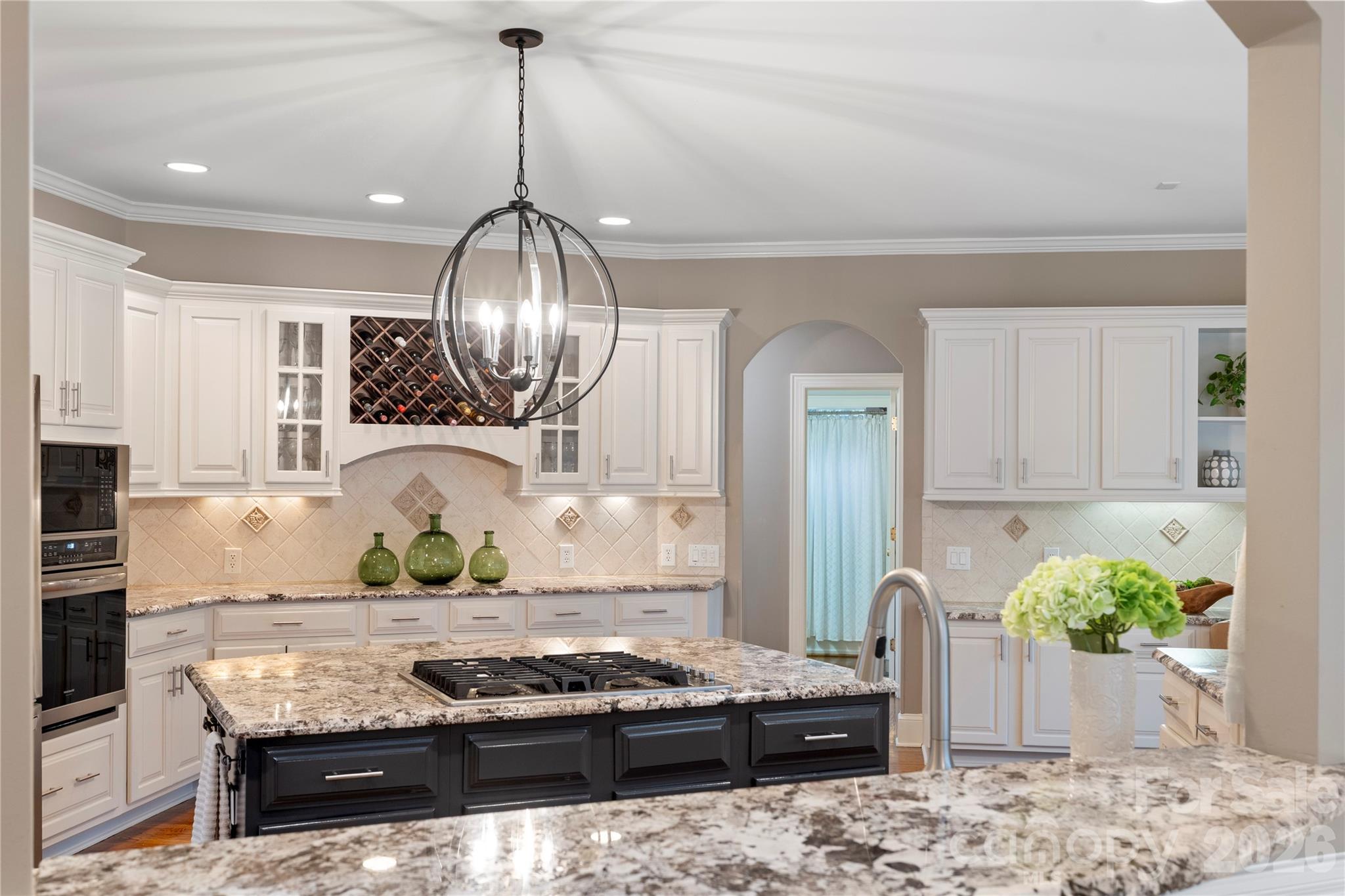 1716 Hickory Ridge Drive Waxhaw, NC 28173 - Photo 13 of 48 a kitchen with granite countertop stove and wooden floor