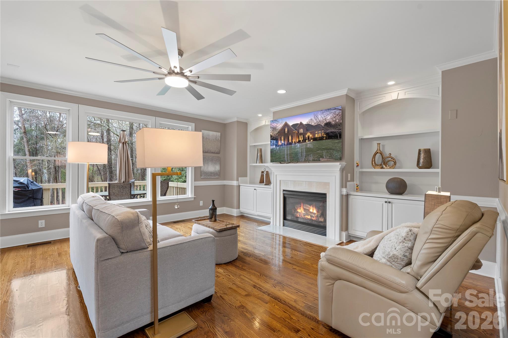 1716 Hickory Ridge Drive Waxhaw, NC 28173 - Photo 16 of 48 a living room with furniture fireplace and a large window