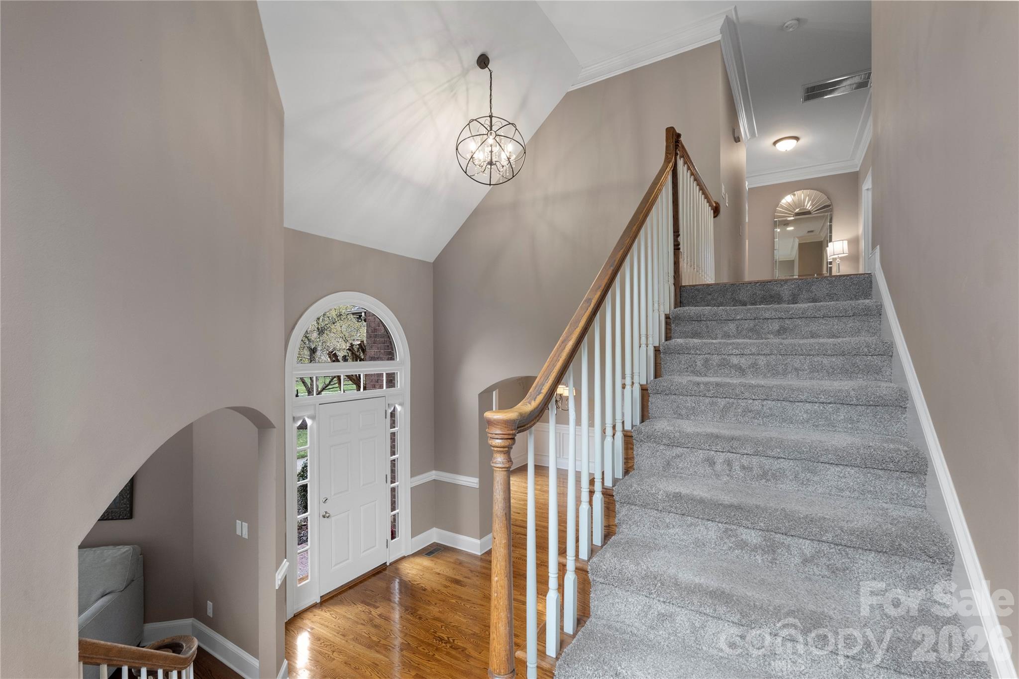 1716 Hickory Ridge Drive Waxhaw, NC 28173 - Photo 19 of 48 a view of a hallway with entryway wooden floor and front door