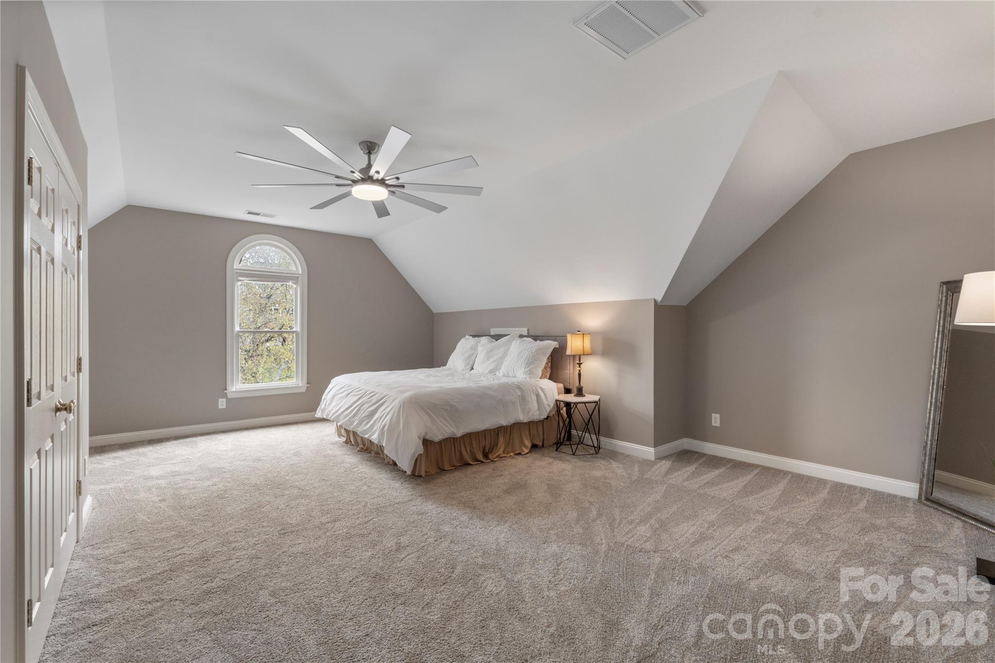 1716 Hickory Ridge Drive Waxhaw, NC 28173 - Photo 37 of 48 a spacious bedroom with a bed and a ceiling fan