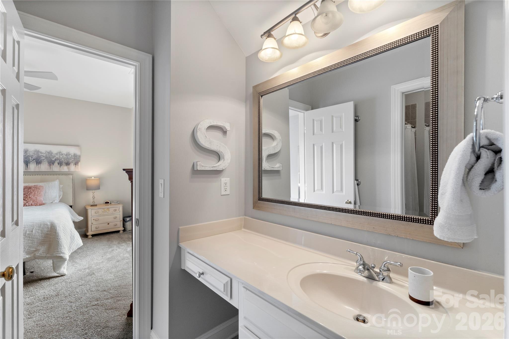 1716 Hickory Ridge Drive Waxhaw, NC 28173 - Photo 40 of 48 a en suite bathroom with a sink and a mirror