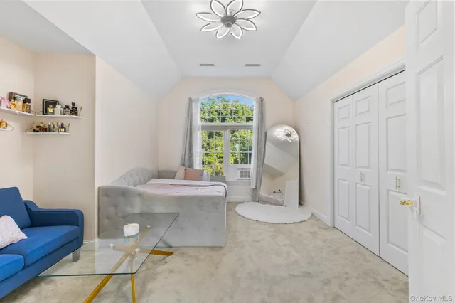 a living room with furniture a table and decor