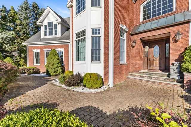 a view of a town with mountains in the background