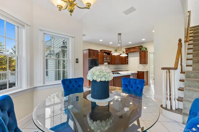 a kitchen with a table and chairs