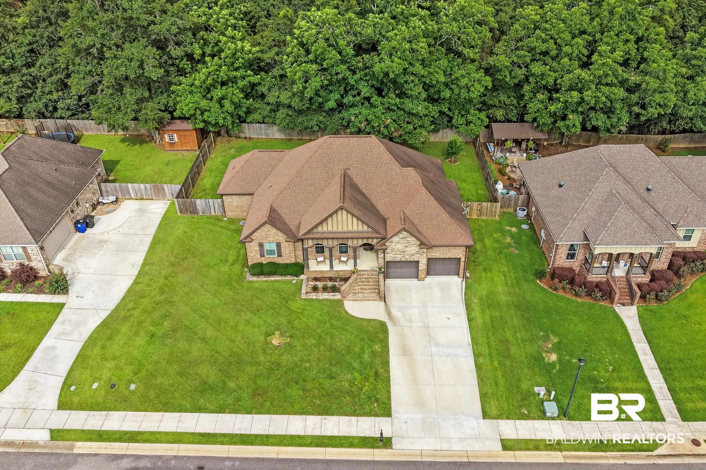 313 Pecan Ridge Boulevard Fairhope, AL 36532 - Photo 37 of 51 Brick and siding exterior with a two-car garage, concrete driveway, and covered front porch