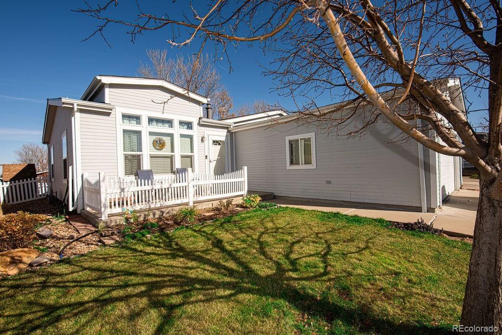 7725 Primrose Green, Unit 165 Frederick, CO 80530 - Photo 22 of 22 a backyard of a house