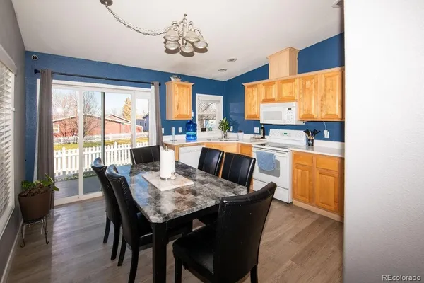 a view of a dining room with furniture window and outside view