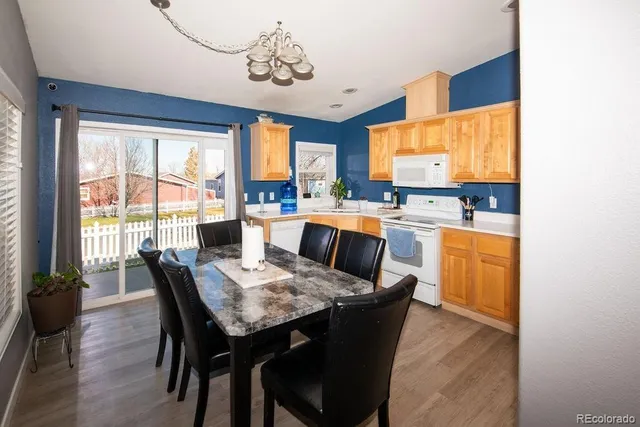 a view of a dining room with furniture window and outside view
