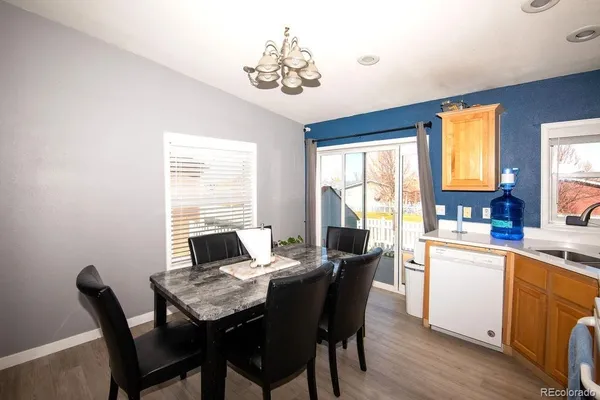 a view of a dining room with furniture and window
