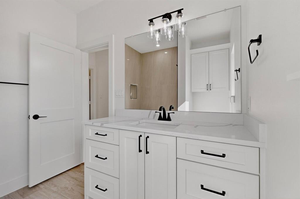 178 Private Road Canton, TX 75103 - Photo 24 of 38 a bathroom with a granite countertop sink vanity mirror and shower