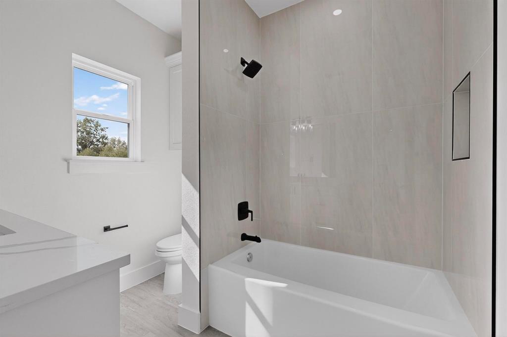 178 Private Road Canton, TX 75103 - Photo 25 of 38 a bathroom with a bathtub a toilet and a shower