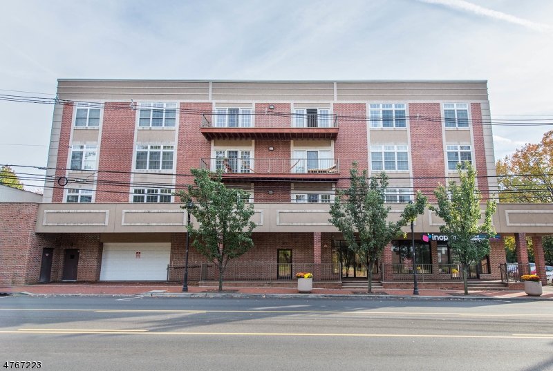 a view of a building and a terrace with a potted plant