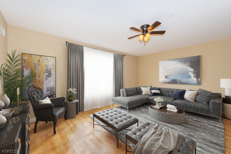 1677 Springfield Avenue, Unit 14 Maplewood, NJ 07040 - Photo 4 of 13 a living room with furniture and a window