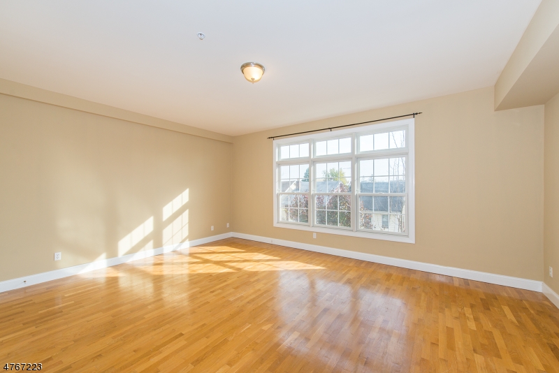1677 Springfield Avenue, Unit 14 Maplewood, NJ 07040 - Photo 5 of 13 a view of an empty room with a window