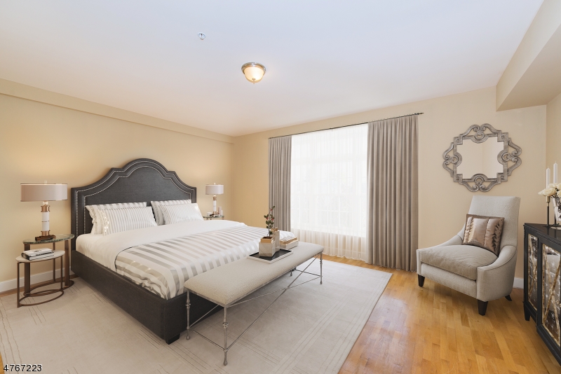 1677 Springfield Avenue, Unit 14 Maplewood, NJ 07040 - Photo 6 of 13 a bedroom with a bed and a lamp with window