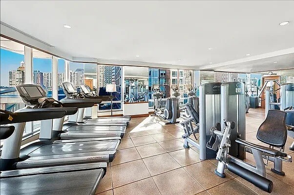 10 West Street, Unit 15C Manhattan, NY 10004 - Photo 18 of 23 a gym hall with exercise machine