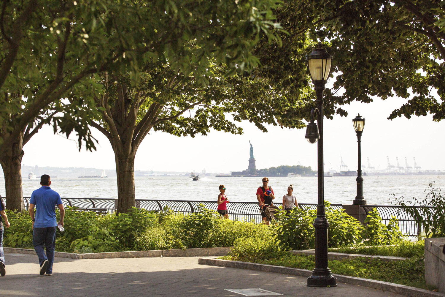 10 West Street, Unit 15C Manhattan, NY 10004 - Photo 21 of 23 a group of people riding bikes down a street