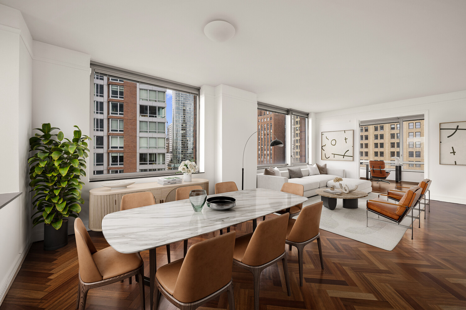 10 West Street, Unit 15C Manhattan, NY 10004 - Photo 3 of 23 a living room with furniture and a potted plant