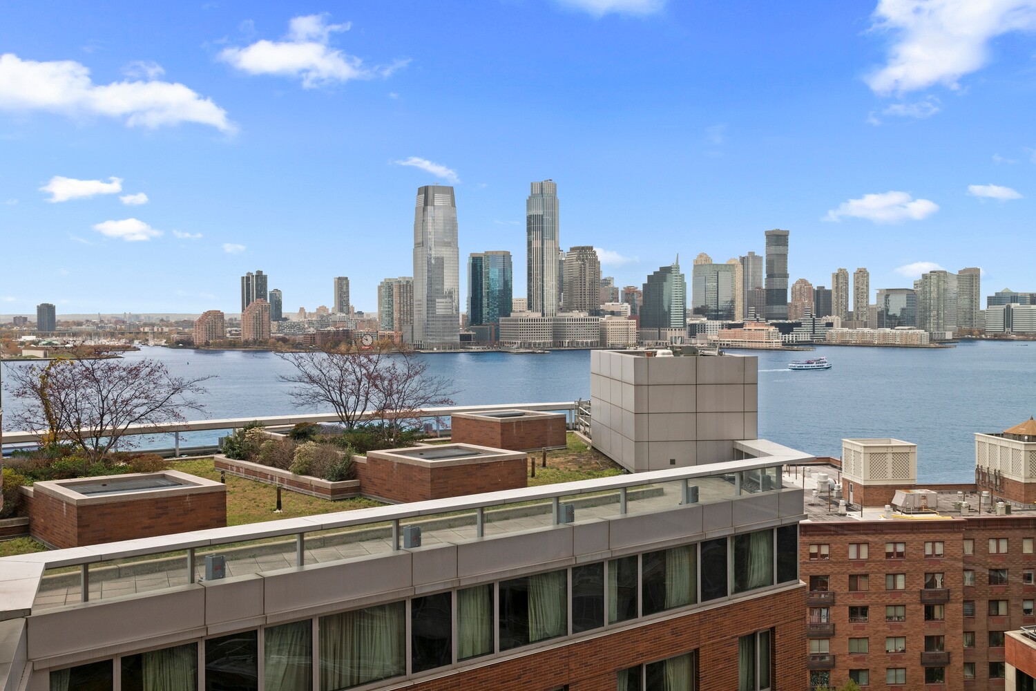 10 West Street, Unit 15C Manhattan, NY 10004 - Photo 5 of 23 a view of a city with tall buildings