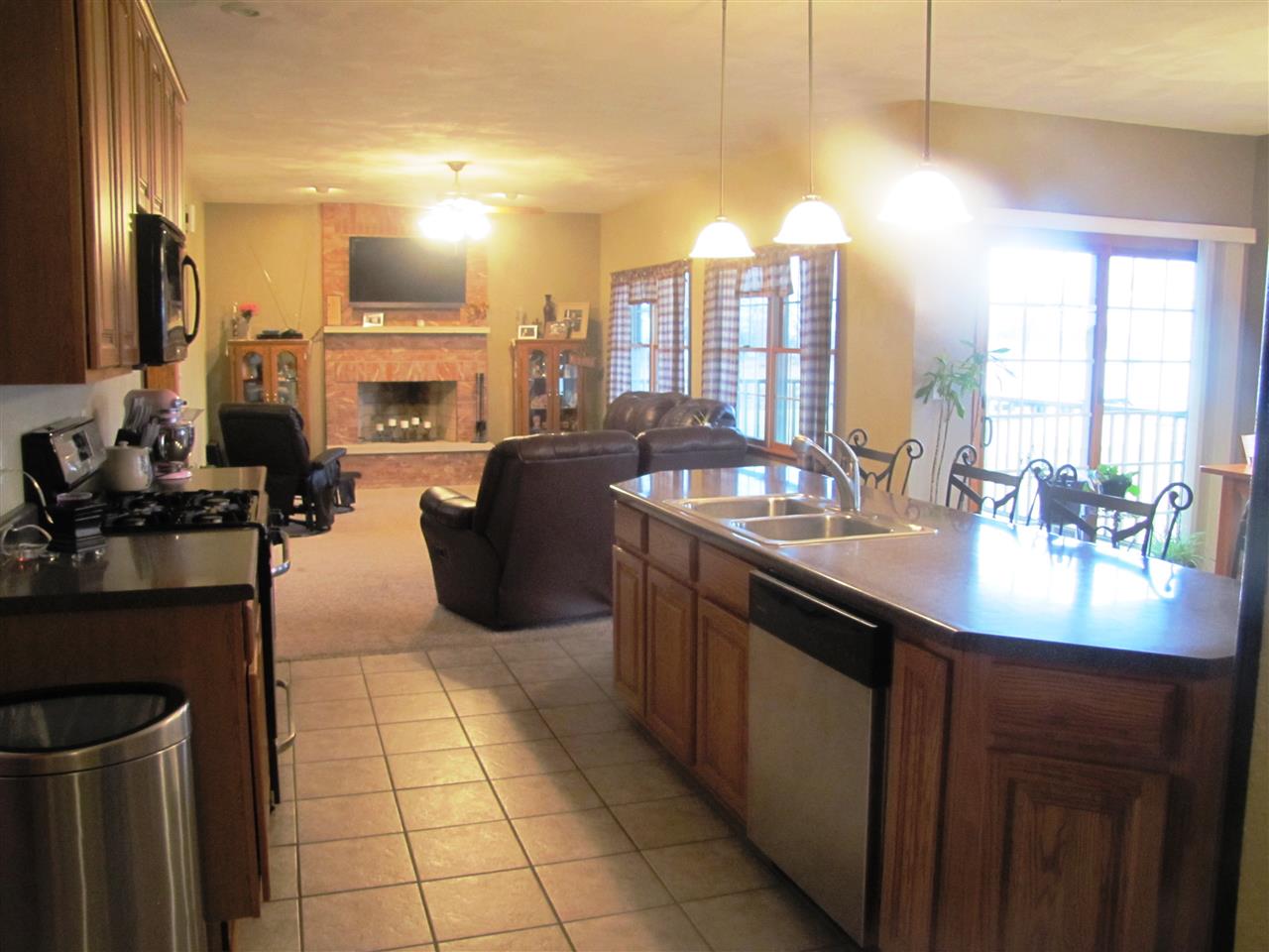 19085 East Crill Road Monroe Center, IL 61052 - Photo 5 of 23 a kitchen with stainless steel appliances a sink stove and cabinets